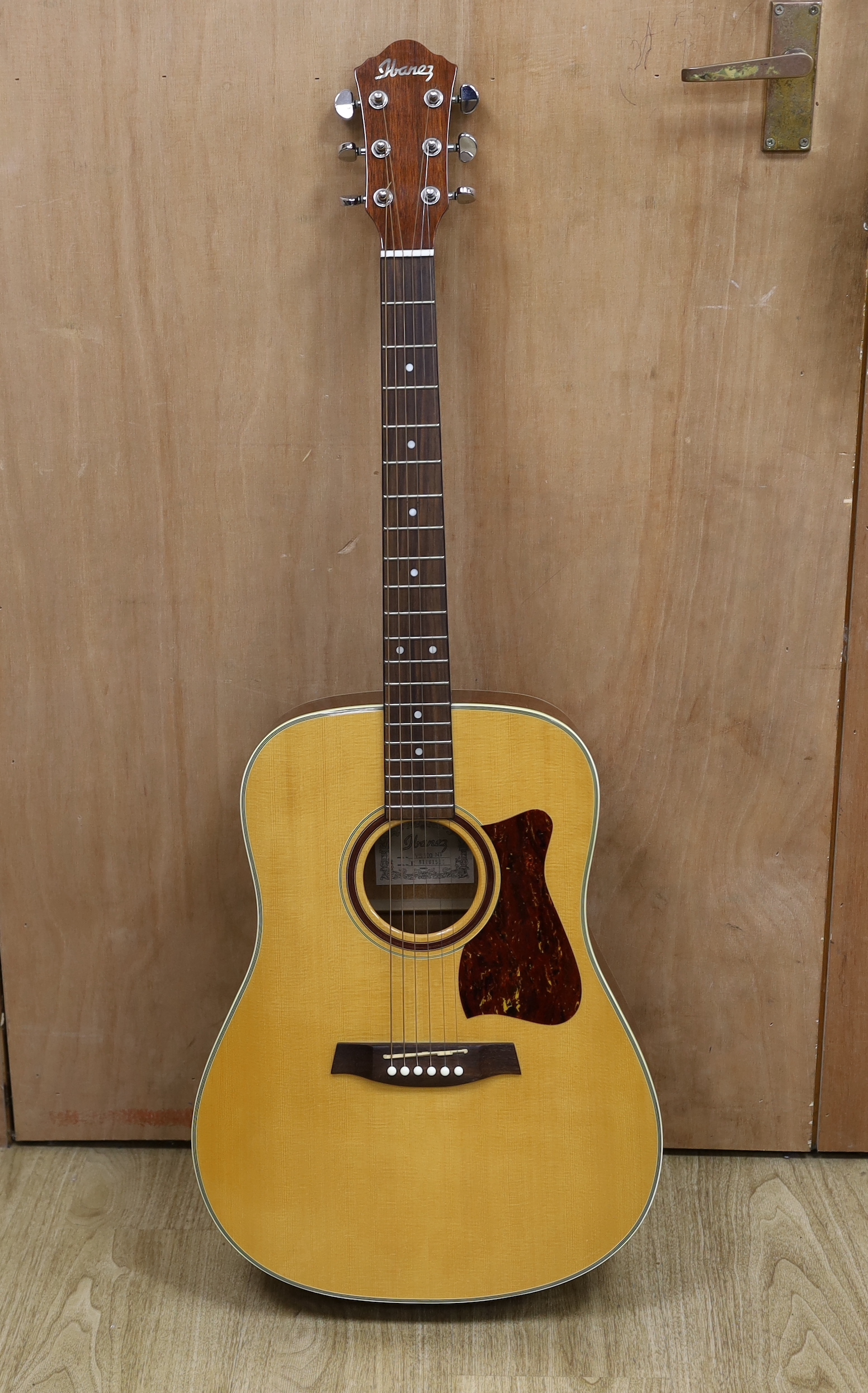 A cased Ibanez acoustic guitar